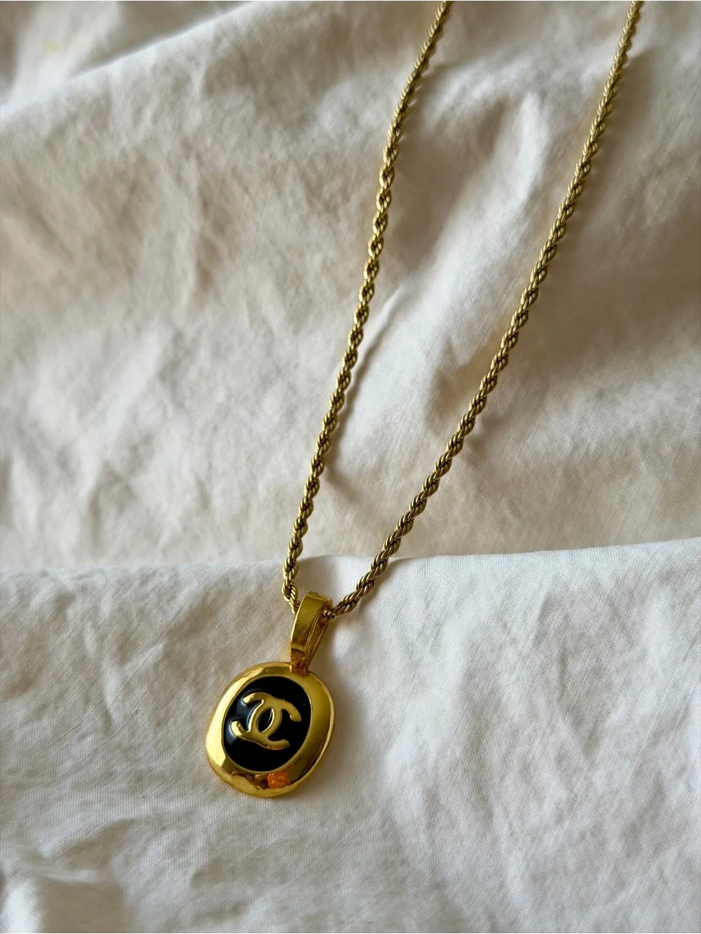 CHANEL Gold and Black Oval CC Pendant Necklace on Rope Chain